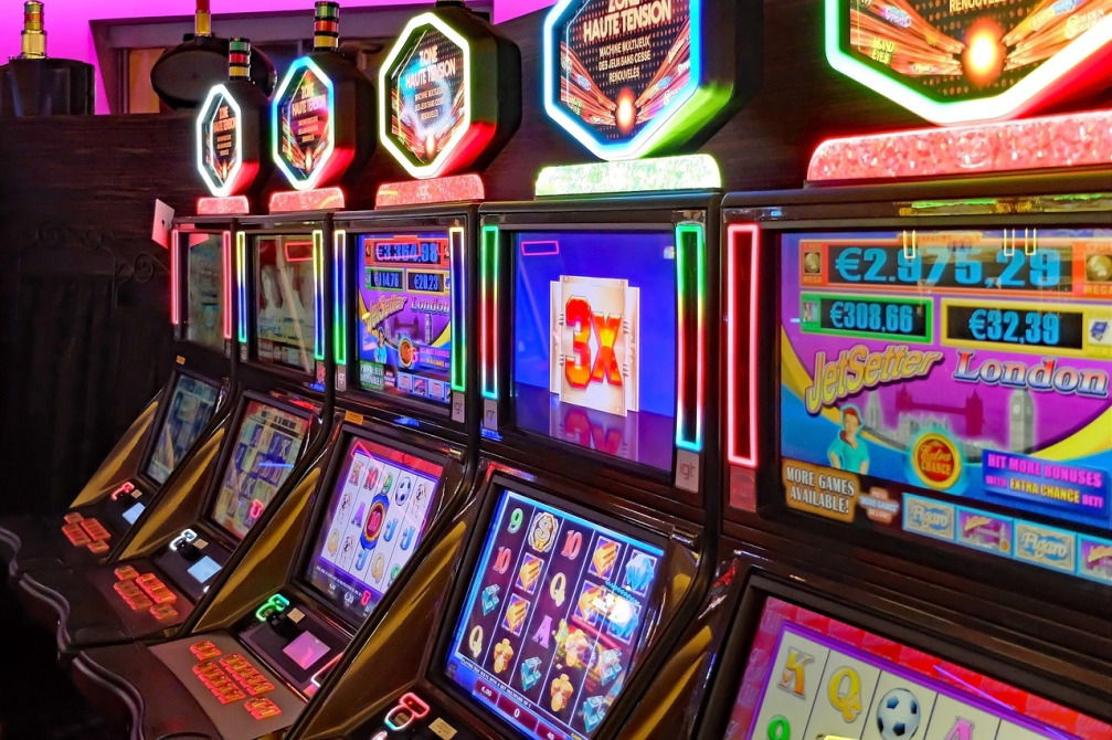 Row of slot machines for online casino games at Adventplay Asean